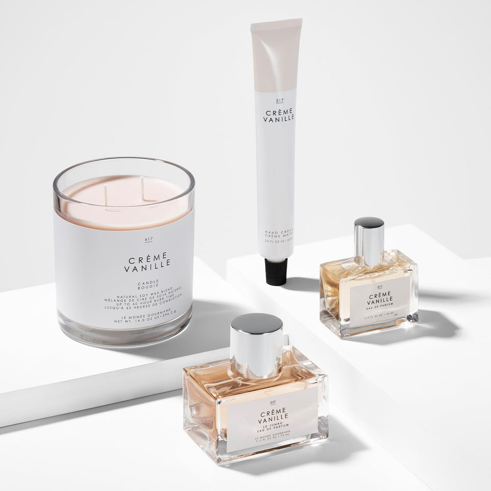 Le Monde Gourmand display with amber glow, ideal for a subtle signature scent.