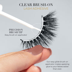 Lilly Lashes clear adhesive being applied to lash band for seamless blend.