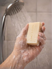 LINDA NATURA Goat Milk Soap Set on bathroom shelf for daily routine.