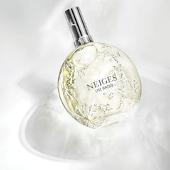 Lise Watier Neiges bottle cap close-up, hinting at premium fragrance experience