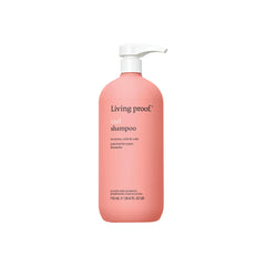 Living Proof Curl Shampoo bottle with pump enables effortless cleansing for defined curls.