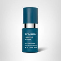 Living Proof triple bond complex hero bottle styled for professional hair care.