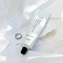LOE Life On Earth hand cream application shows hydrating texture and scent.