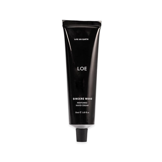 LOE Life On Earth hand cream tube with SINCERE WOOD fragrance for daily hydration.