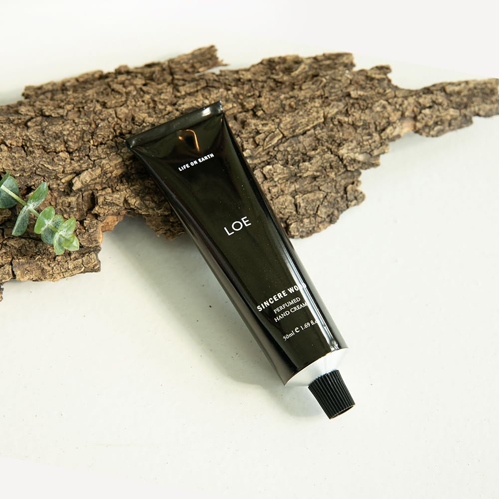 SINCERE WOOD fragrance swatch on LOE hand cream preview.