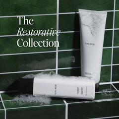 LolaVie Restorative Conditioner bottle highlights bond-building care for smoother, softer strands.