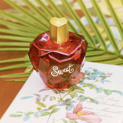 Lolita Lempicka Sweet cap detail in gold finish adds luxury to your routine