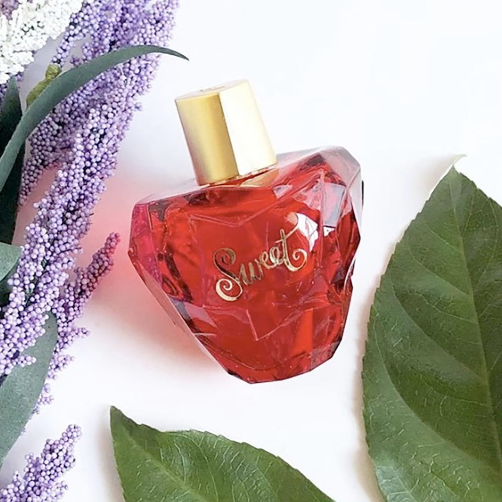 Lolita Lempicka Sweet bottle scent swirl inviting a feminine aura for daily wear