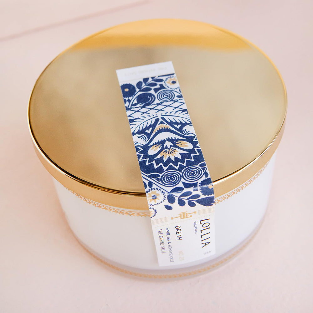 LOLLIA Dream Bath Salt being poured into a warm tub for a fragrant soak