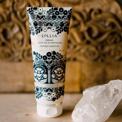 Hands applying Dream Shower Gel on skin for a refreshing cleanse