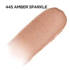 Close-up of doe-foot applicator applying Brilliant Eyes Amber Sparkle with precision