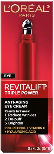 L'Oreal Paris Revitalift eye cream applicator metal tip in use, delivering refreshing cooling hydration