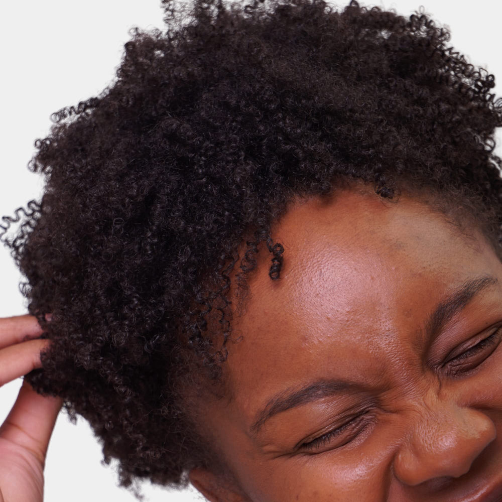 Love Ur Curls fragrance-free curl cream with shea butter and moringa nourishes hair.