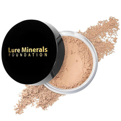 Lure Minerals Bisque loose powder jar for a natural finish on light skin.