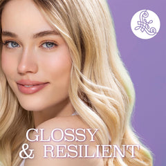 Luseta Biotin & Collagen spray applied to dry hair for protection.