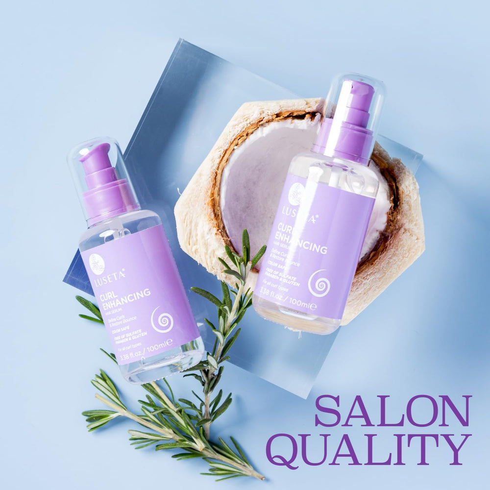 Applying Luseta Curl Enhancing Hair Oil to curly hair for moisture and manageability.