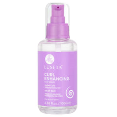 Luseta Curl Enhancing Hair Oil bottle pour for frizz control and shine.