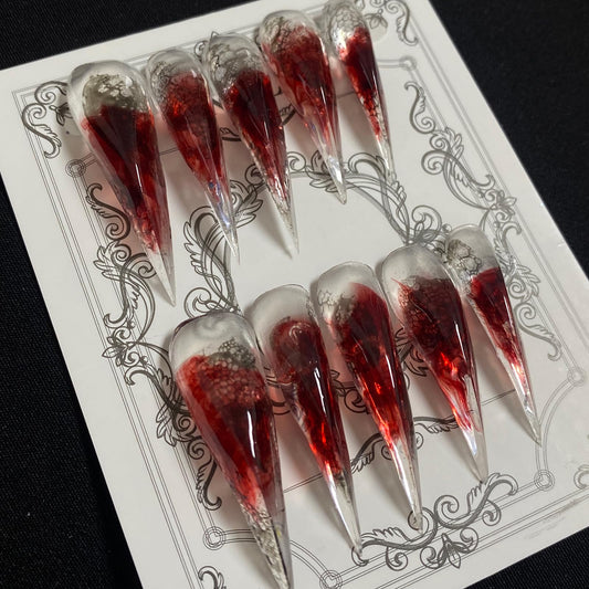 MABKJLF Halloween press-on nails in long stiletto shape for salon-like at-home manicure.