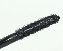 MAC mascara wand in action delivering enhanced volume and lift.