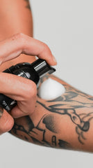 Mad Rabbit tattoo aftercare foam in action during early recovery phase.
