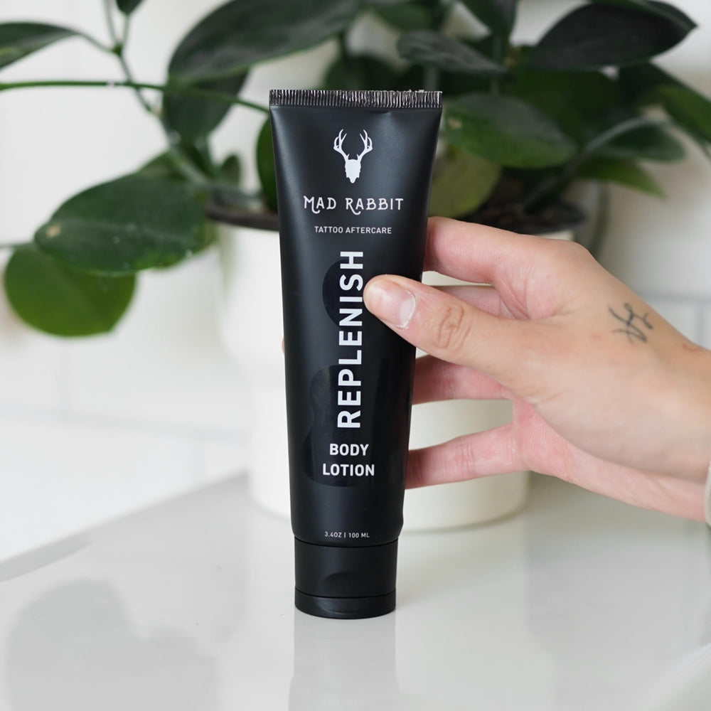 Close-up of fragrance-free label on Mad Rabbit Replenish Tattoo Body Lotion