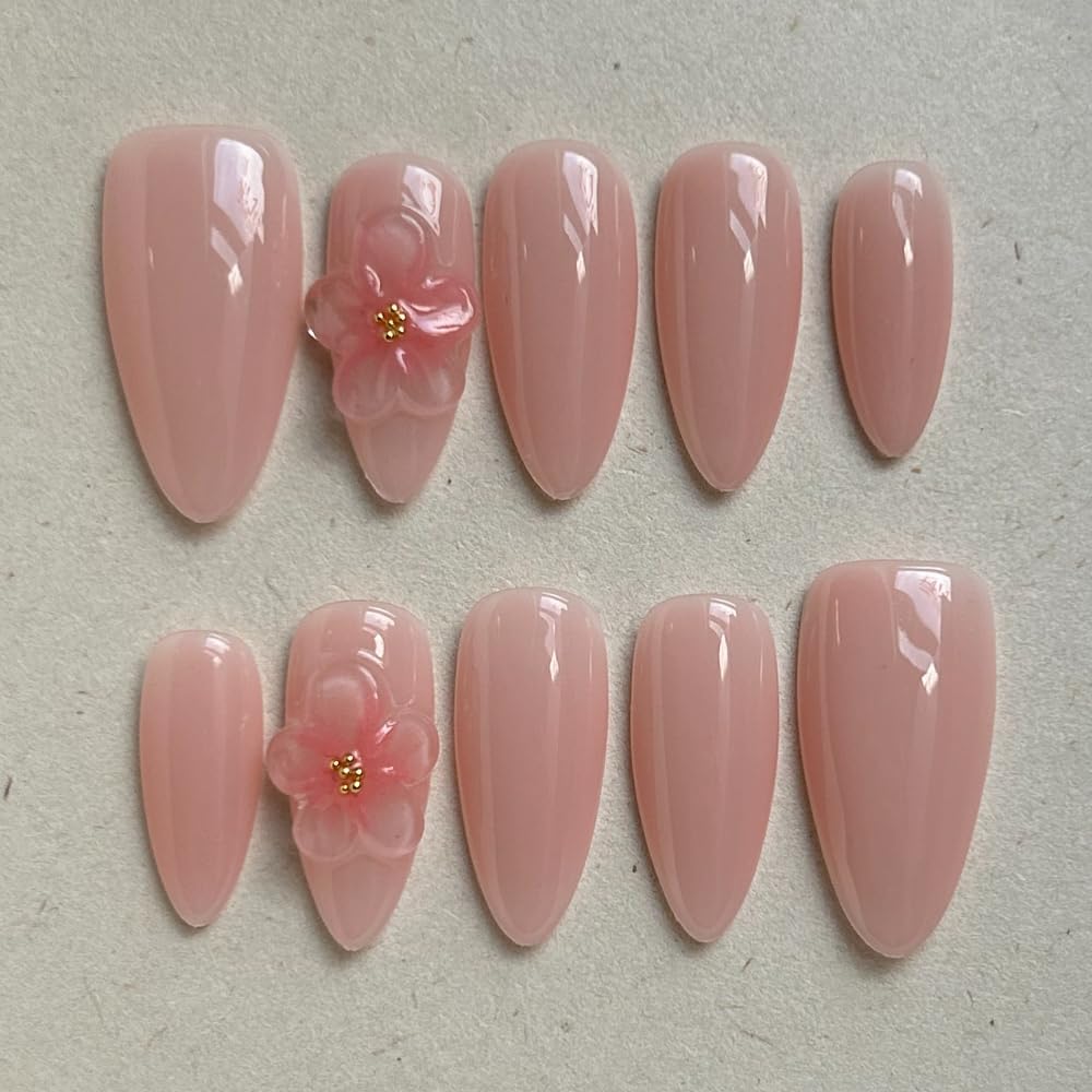 Maglfell press-on nails in medium almond, close-up, salon-like shine.