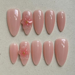 Maglfell press-on nails in medium almond, close-up, salon-like shine.