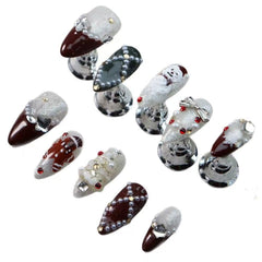 Maigitur almond-shaped nails with dark red French tips for bold holiday elegance.