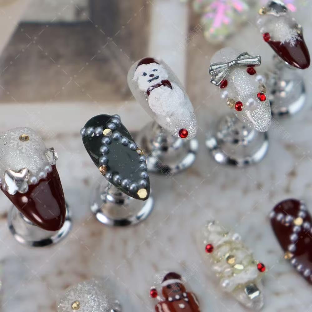 Maigitur closeup of handmade almond nails with a precise gel finish.