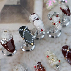 Maigitur closeup of handmade almond nails with a precise gel finish.