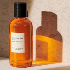 Maison Louis Marie No.04 label highlights sandalwood and amber notes.