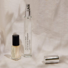 Vanity setup featuring Maison Louis Marie No.04 minis for travel fragrance.