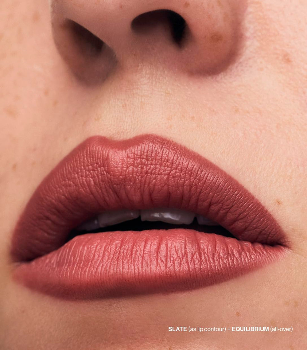 Blending brush beside MAKE Lip Continuum slate for seamless blending