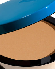 Travel-friendly bronzer compact with refillable pan for easy on-the-go use
