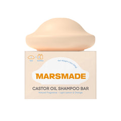 Mars Made Castor Oil Shampoo Bar packaging in focus, bottle-free design.