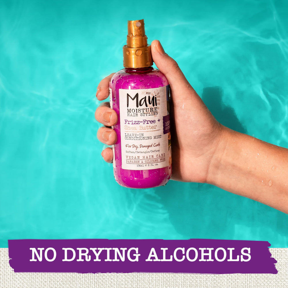 Maui Moisture Frizz-Free Leave-In Mist applied to damp hair for detangling.