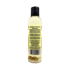 Maui Monoi Pikake Rose Oil being applied to hands for moisturized skin.