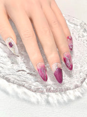 Medium almond press on nails with 3D pearl detailing for an elegant finish