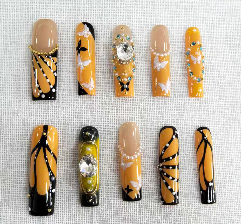 Meemooron glossy rhinestone nails in yellow provide a striking finish for events.