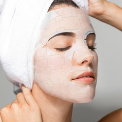 MEGELIN botanical facial mask on face demonstrates comfortable, spa-like fit.