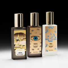 Memo Paris Marfa on a reflective surface evokes elegant evening fragrance ritual.