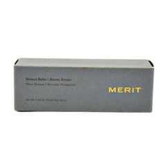 MERIT Bronze Balm Quince application on face blends seamlessly for subtle contour.