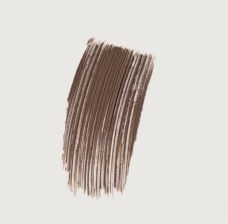 Merit Brow 1980 volumizing eyebrow pomade brush stroke for precise shaping and lasting hold.