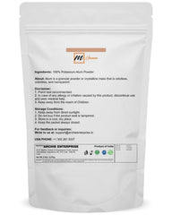 mGanna alum powder pouring from a pouch into a container for purification use.