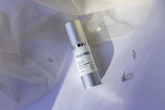 MiamiMD Dark Glow Renewal Serum jar with droplets, fragrance-free formula.