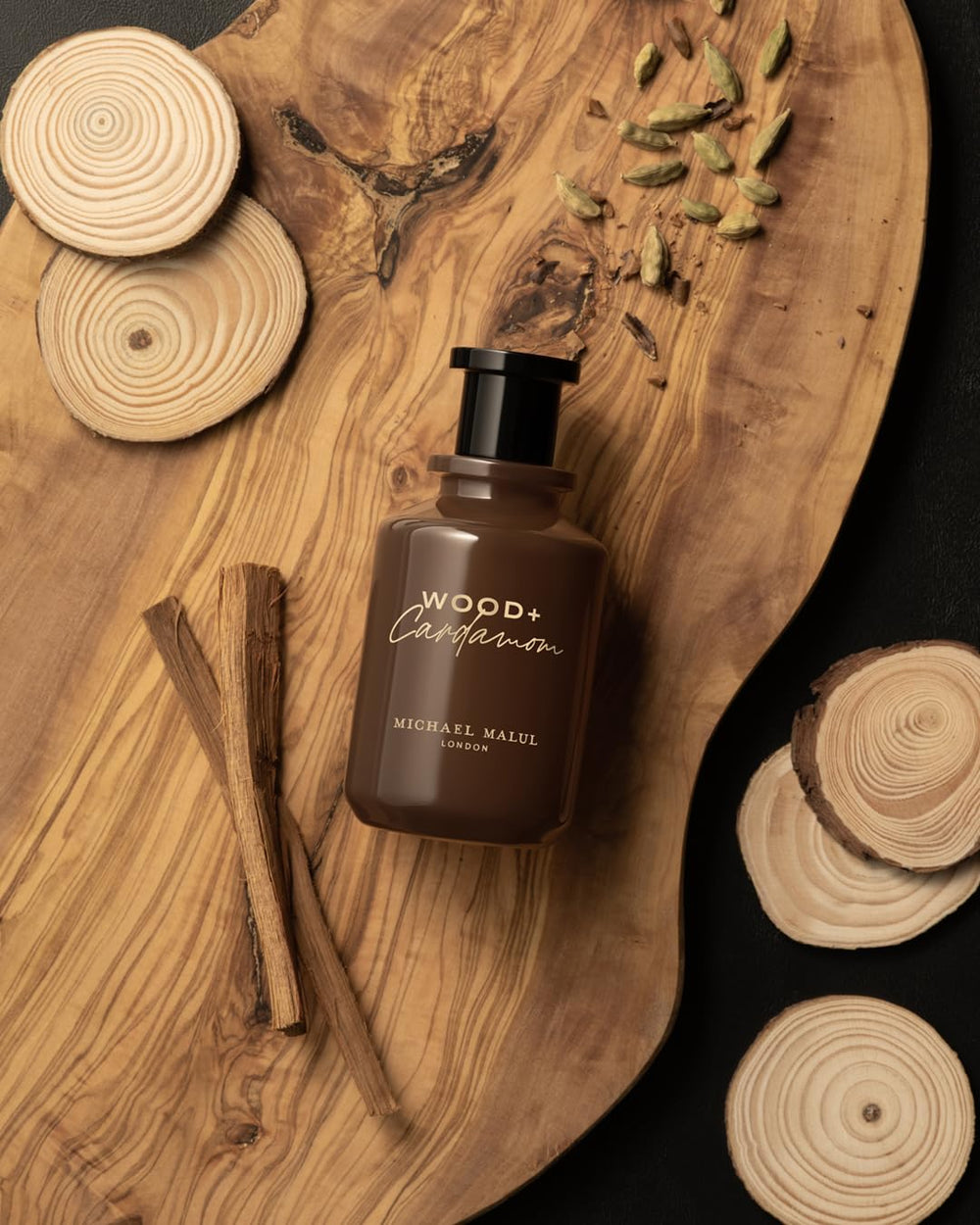 Swirl on the skin to release Michael Malul Wood + Cardamom aroma.