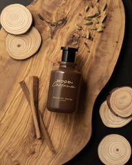 Swirl on the skin to release Michael Malul Wood + Cardamom aroma.