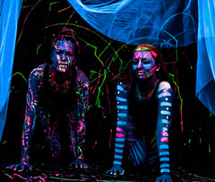 Midnight Glo blue UV neon paint pops at night festivals under UV lighting.