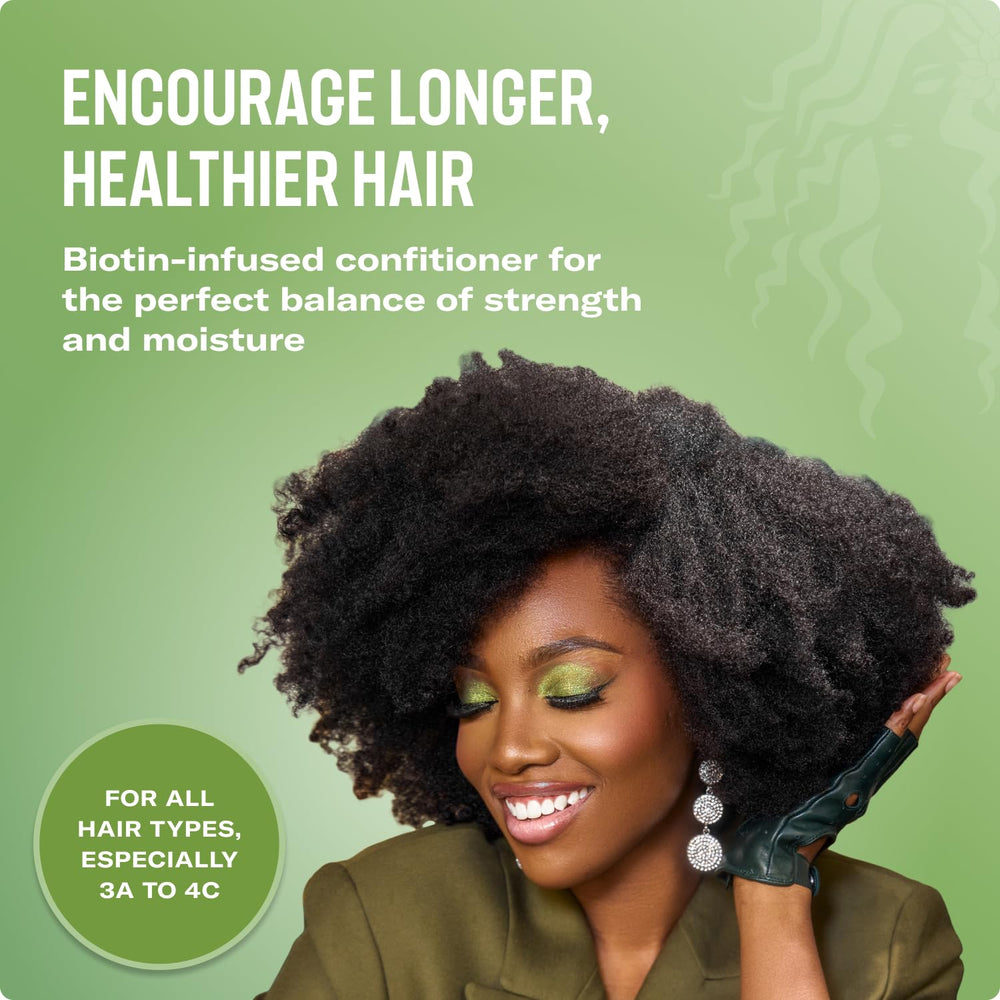 Close-up shows biotin-rich ingredients in Mielle Organics Rosemary Mint conditioner.