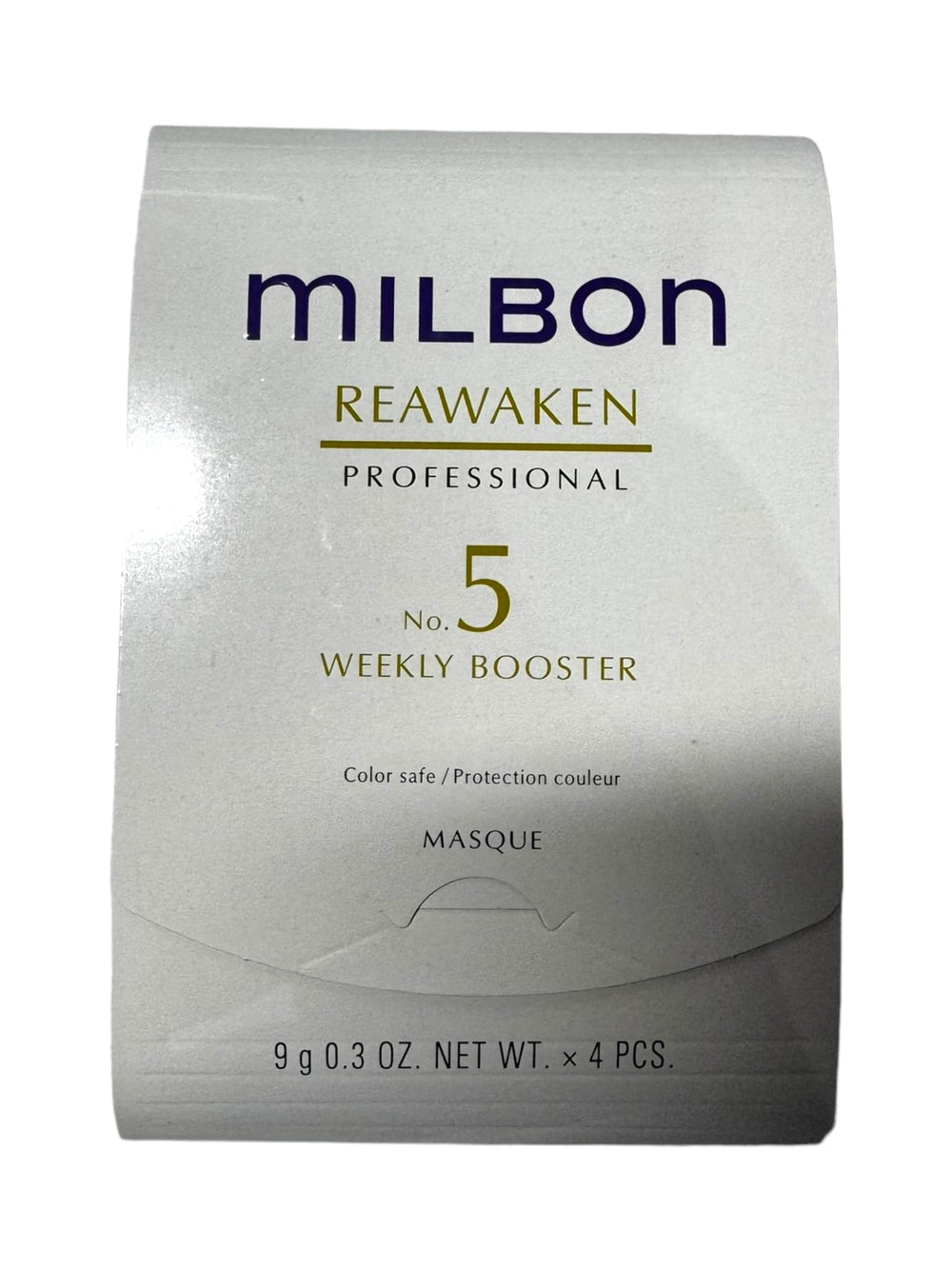 Milbon No. 5 Reawaken bottle pour showing moisturizing booster for dry, aging hair.